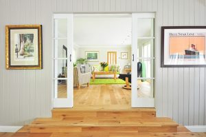 living room with natural light and white walls