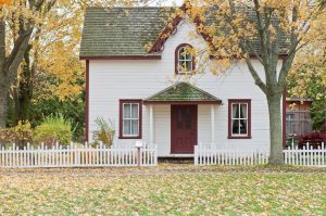 white house with picket fence